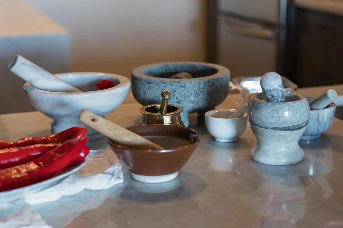 Mortars and pestles in Shayma Owaise Saadat’s kitchen in Toronto. Saadat and three other cooks share the utensils and gadgets that they must have in their kitchens.  (NARISA LADAK/The New York Times)