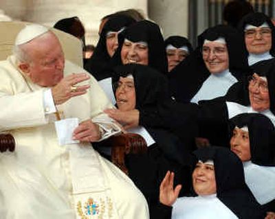 
Pope John Paul II is greeted by nuns during the weekly general audience in the Paul VI hall at the Vatican in this Oct. 20, 2004, photo. 
 (File/Associated Press / The Spokesman-Review)