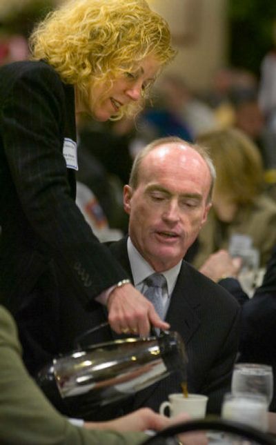 
Janie Hession pours coffee for her husband, Spokane Mayor Dennis Hession, on Friday morning at the Spokane Regional Chamber of Commerce meeting. Hession received several standing ovations during his State of the City address to the chamber at the downtown Doubletree Hotel.
 (Christopher Anderson/ / The Spokesman-Review)
