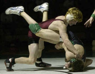 
U-Hi's Cory Fish has upper hand en route to pin of East Valley's Aaron Start at the GSL championship dual meet on Saturday. 
 (Liz Kishimoto / The Spokesman-Review)