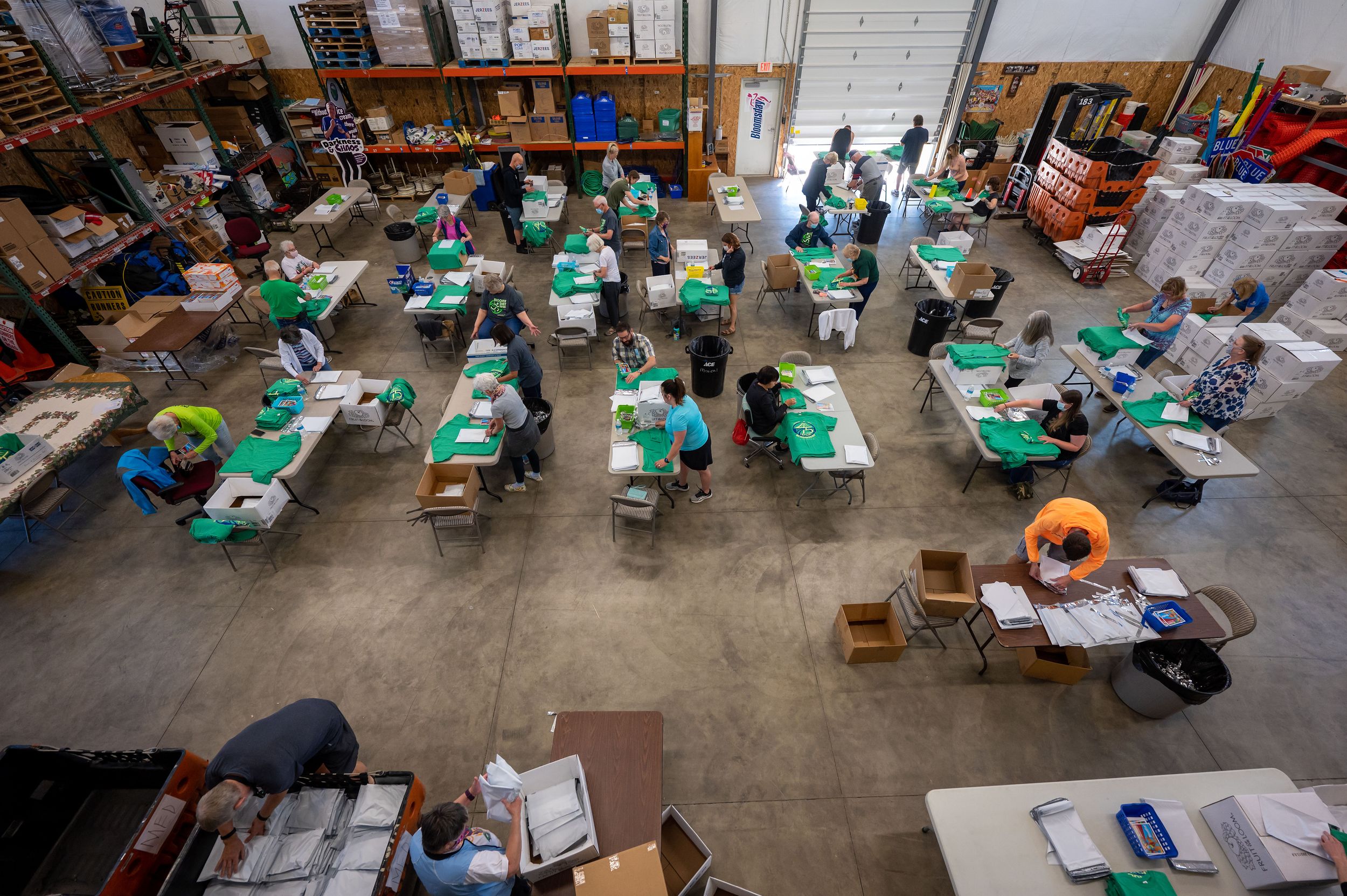 Bloomsday volunteers prep finisher Tshirts to mail across the world