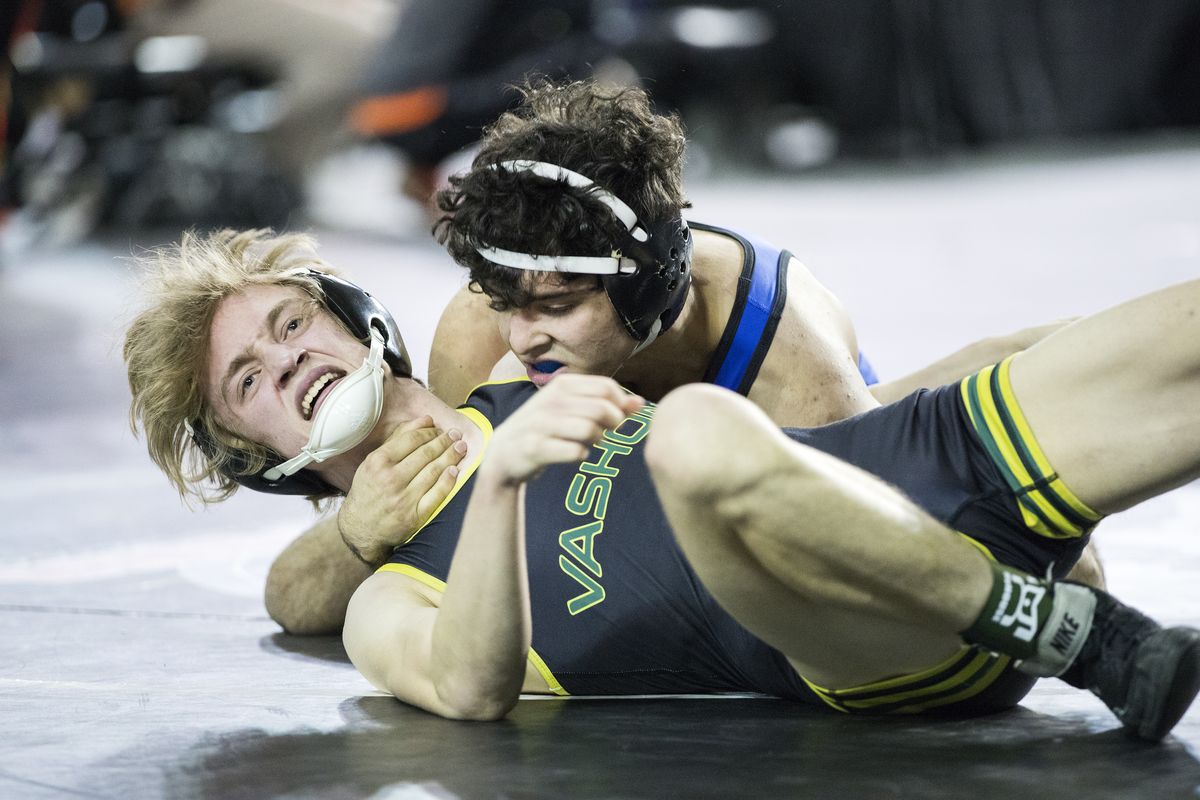 Vashon Island’s George Murphy, left, doesn’t look happy to be in the grip of Deer Park’s Nathan Gregory during their 126 lb. match Friday, Feb. 18, 2022, at the 1A State Wrestling Championships in Tacoma, Wash. Gregory won the match by pin. (Photo by Patrick Hagerty)  (Patrick Hagerty)