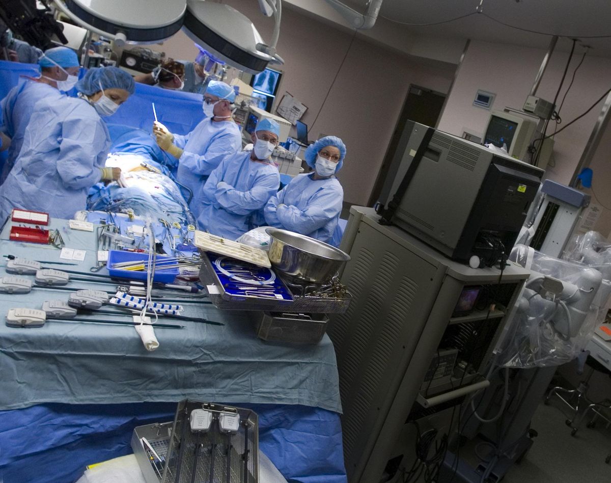 FILE - Doctors perform a robotic heart procedure at Sacred Heart hospital in 2006. (SR)