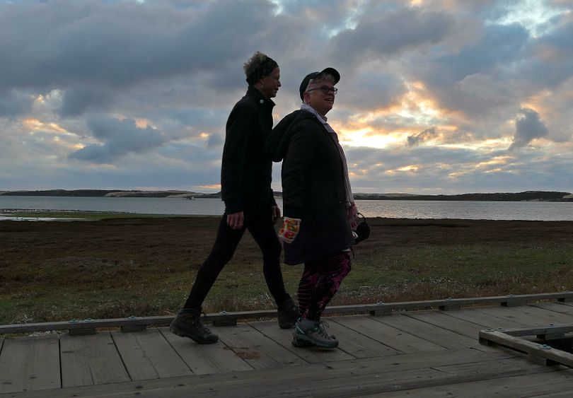 A sunset walk on the boardwalk at Morro Bay, Calif. (John Nelson)