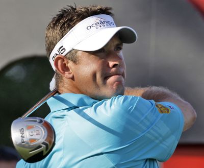 Lee Westwood from England tees off on the 16th hole at the Earth course, during the first round of Dubai World Championship.  (Associated Press)