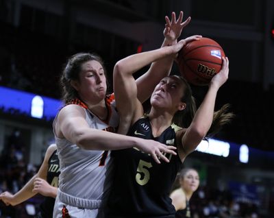 Idaho's Beyonce Bea attempts to get through the defense of Idaho State's Estefania Ors in Friday's Big Sky Conference Tournament championship game in Boise. The Bengals handled the Vandals 84-49.   (Courtesy of Brooks Nuanez )