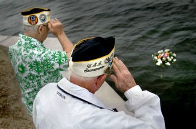 
Pearl Harbor survivors salute after placing a wreath in water Wednesday at Fort Lauderdale U.S. Coast Guard Station. 
 (Associated Press / The Spokesman-Review)