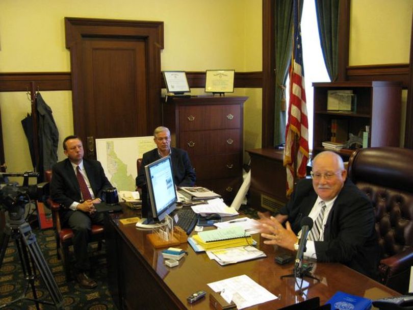 Idaho Secretary of State Ben Ysursa, right, along with Idaho GOP Chairman Norm Semanko, left, and Idaho Democratic Party Chairman Larry Grant, center, speak to the press on Monday morning. (Betsy Russell)