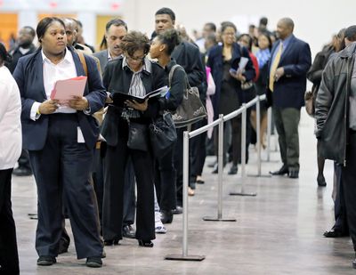 Applicants line up for the opening of the job fair held by Hartsfield Jackson Airport in Atlanta in March 27, 2018. (Associated Press)