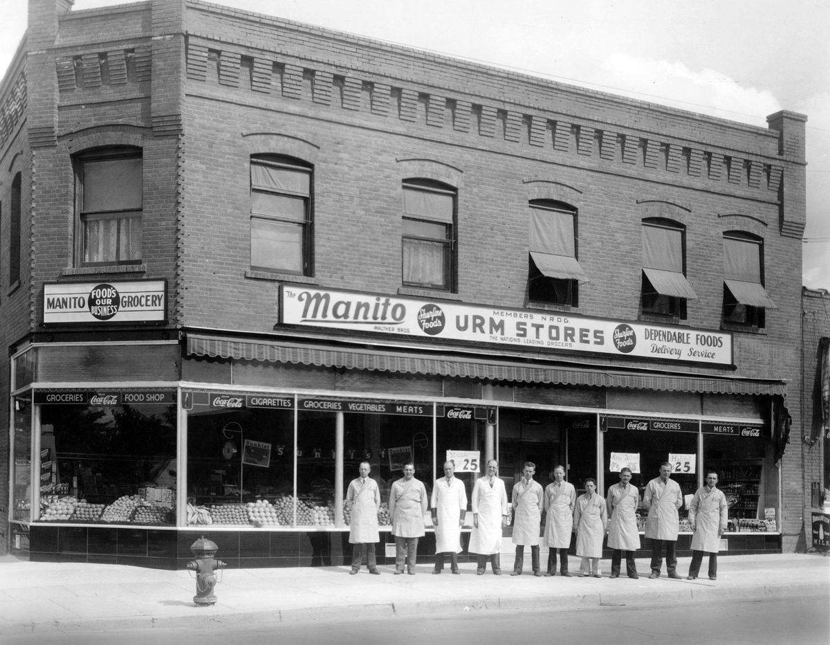 1940: Manito Grocery was founded in 1907 and moved to this two-story building at 30th Avenue and Grand Boulevard in 1911. Founding brothers Herbert W. and Edward H. Walther ran the grocery until Ed died in 1966 and the building was torn down in 1969 to make way for the Manito Shopping Center. Pictured are, from left, unidentified, Paul Walther, Herb Walther, Ed Walther, Mal Johnson, Bert Sisson, Howard Bushnell, Hubert Klaue, Art Thompson and Les Willard. (Spokesman-Review Photo Archive courtesy of Elinore Biermann)