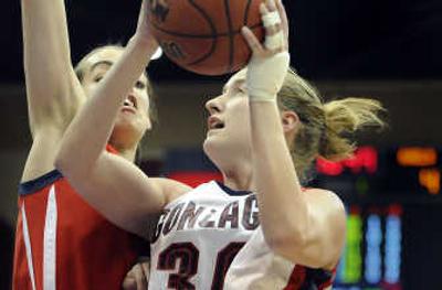 
Gonzaga's Heather Bowman moves toward a three-point play against Louella Tomlinson of Saint Mary's in Saturday's semifinal. 
 (Christopher Anderson / The Spokesman-Review)