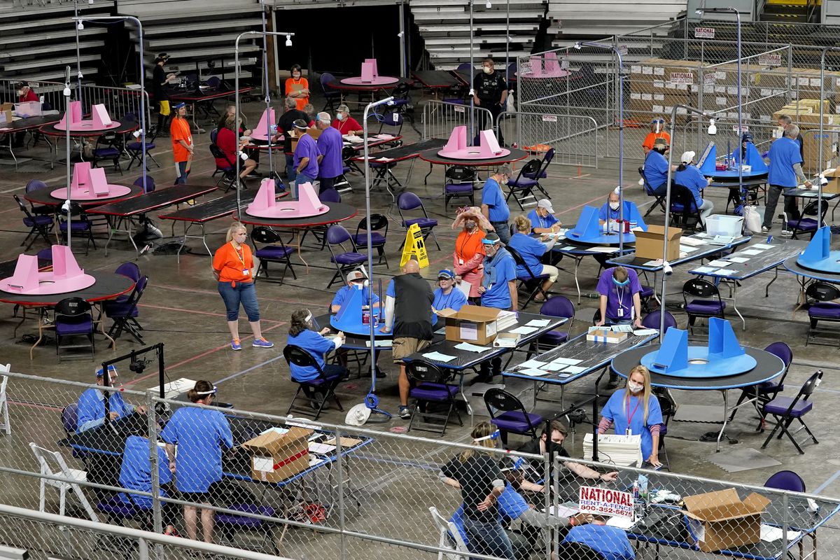Maricopa County ballots cast in the 2020 general election are examined and recounted by contractors working for Florida-based Cyber Ninjas on May 6, 2021, at Veterans Memorial Coliseum in Phoenix.  (Matt York)