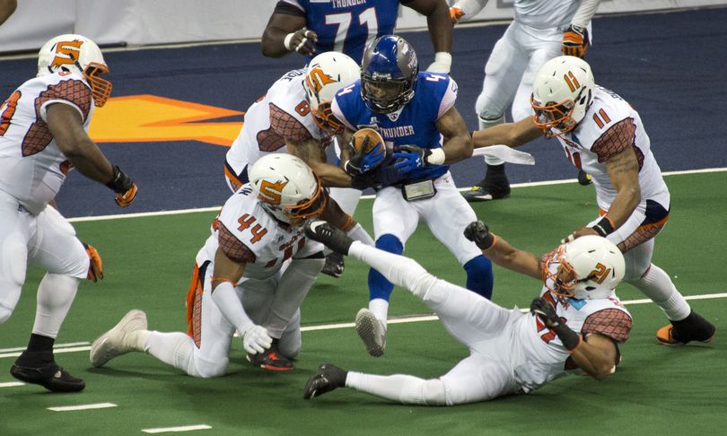 Spokane Shock defense surround Portland Thunder's Duane Brooks for a loss on the finalplay of the second quarter, April 12, 2014, at the Spokane Arena.  DAN PELLE danp@spokesmn.com (Dan Pelle / The Spokesman-Review)