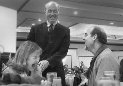 
Before delivering his State of the City address, Spokane Mayor Dennis Hession jokes Friday with City Council member Nancy McLaughlin and Dave McLaughlin. Hession gave the speech to Greater Spokane Incorporated, a business group. 
 (Christopher Anderson / The Spokesman-Review)