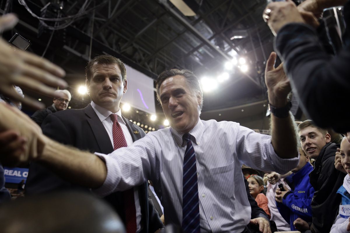 Republican presidential candidate and former Massachusetts Gov. Mitt Romney greets supporters at a New Hampshire campaign rally at Verizon Wireless Arena in Manchester, N.H., Monday, Nov. 5, 2012. (Charles Dharapak / Associated Press)