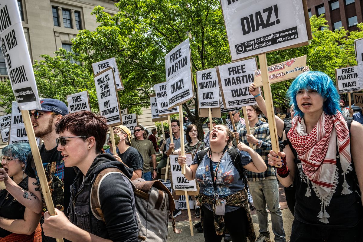 About 50 protesters gathered in the courtyard of the Thomas S. Foley United States Courthouse to support immigrant Martin Diaz, who was in federal court Monday in downtown Spokane. (COLIN MULVANY /THE SPOKESMAN-REVIEW)
