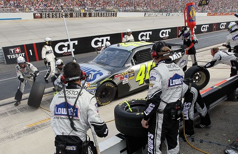 The No. 48 team, lead by crew chief Chad Knaus, perform a pit stop the car driven by Jimmie Johnson during the NASCAR Sprint Cup Series AAA 400 at the Monster Mile. (Photo courtesy of Jim McIsaac/Getty Images for NASCAR) (Jim Mcisaac / Getty Images North America)