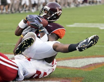 Virginia Tech flanker Dyrell Roberts hauls in the winning touchdown for the Hokies.  (Associated Press / The Spokesman-Review)
