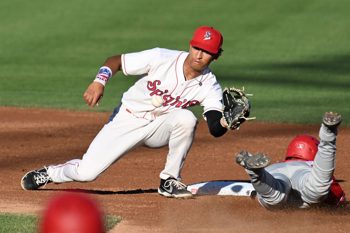 Spokane Indians’ shortstop Ryan Ritter, left, tags out Vancouver’s Josh Kasevich during a stolen-base attempt Tuesday at Avista Stadium in Spokane.  (Jesse Tinsley/THE SPOKESMAN-REVIEW)