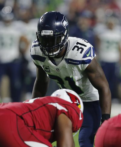Seattle Seahawks strong safety Kam Chancellor remains a holdout and has been ruled out of Sunday's opener. (Associated Press)