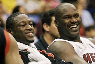 
Expect Miami's Dwyane Wade, left, and Shaquille O'Neal to have another cheery year. 
 (Associated Press / The Spokesman-Review)