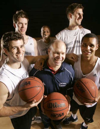 
St. Mary's College basketball players and coaches, clockwise from top center: assistant coach David Patrick, Ben Allen, Patrick Mills, head coach Randy Bennett, Carlin Hughes, and Lucas Walker. The four players and assistant coach are from Australia. Associated Press
 (Associated Press / The Spokesman-Review)