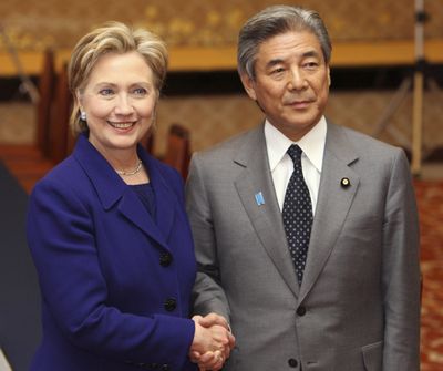 Secretary of State Hillary Rodham Clinton shakes hands with Japan’s Foreign Minister Hirofumi Nakasone  in Tokyo.  (Associated Press / The Spokesman-Review)