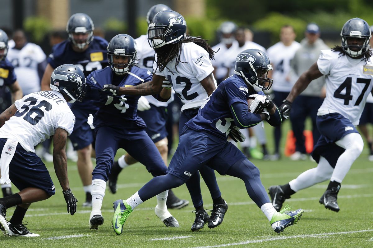 Seahawks running back Christine Michael, second from right, will be seeing a lot of action in practice with Marshawn Lynch holding out. (Associated Press)