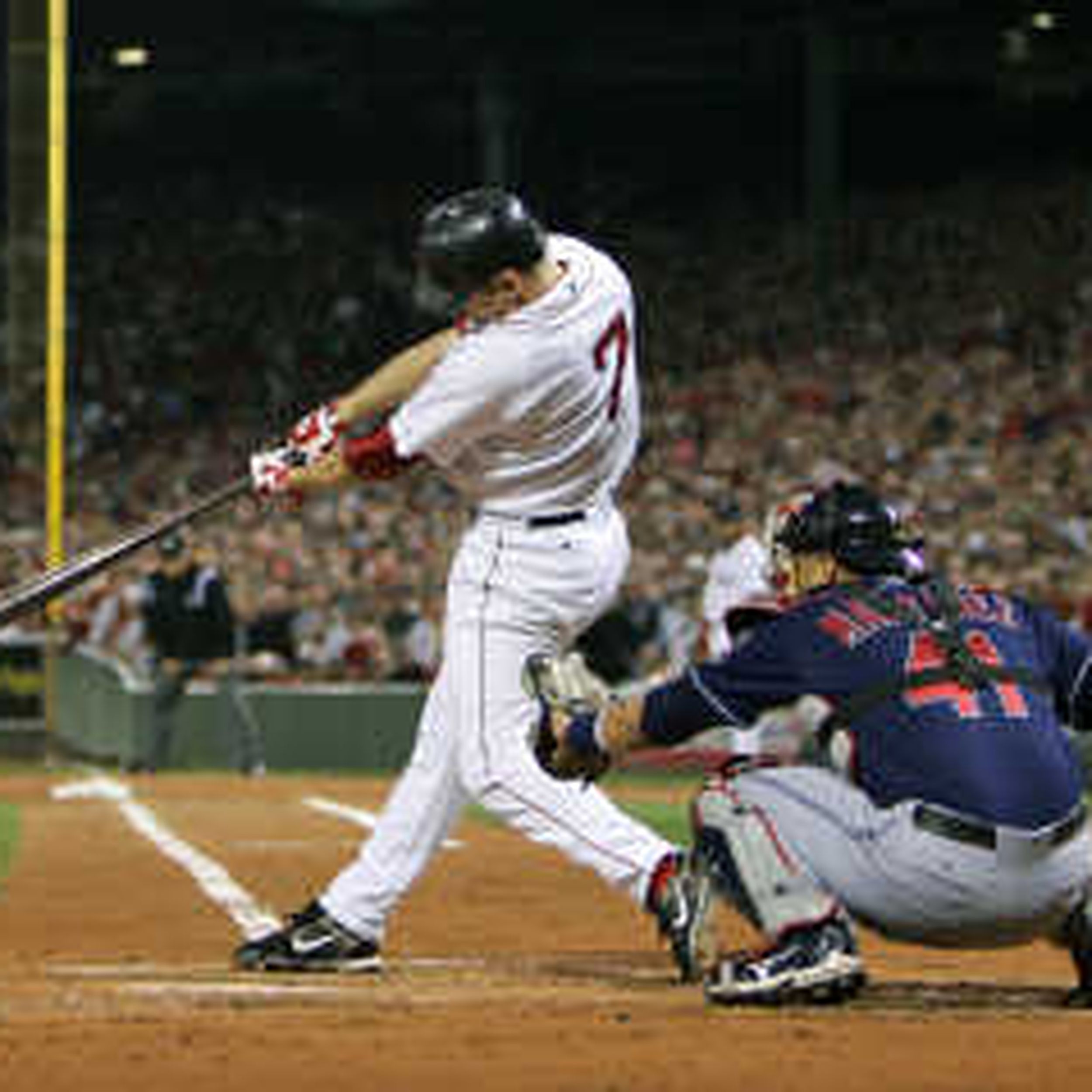 Boston Red Sox' Manny Ramirez swings for a grand slam during the