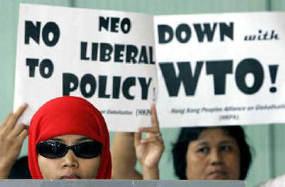 
Protesters display placards near the International Monetary Fund office in Hong Kong on Tuesday. 
 (Associated Press / The Spokesman-Review)