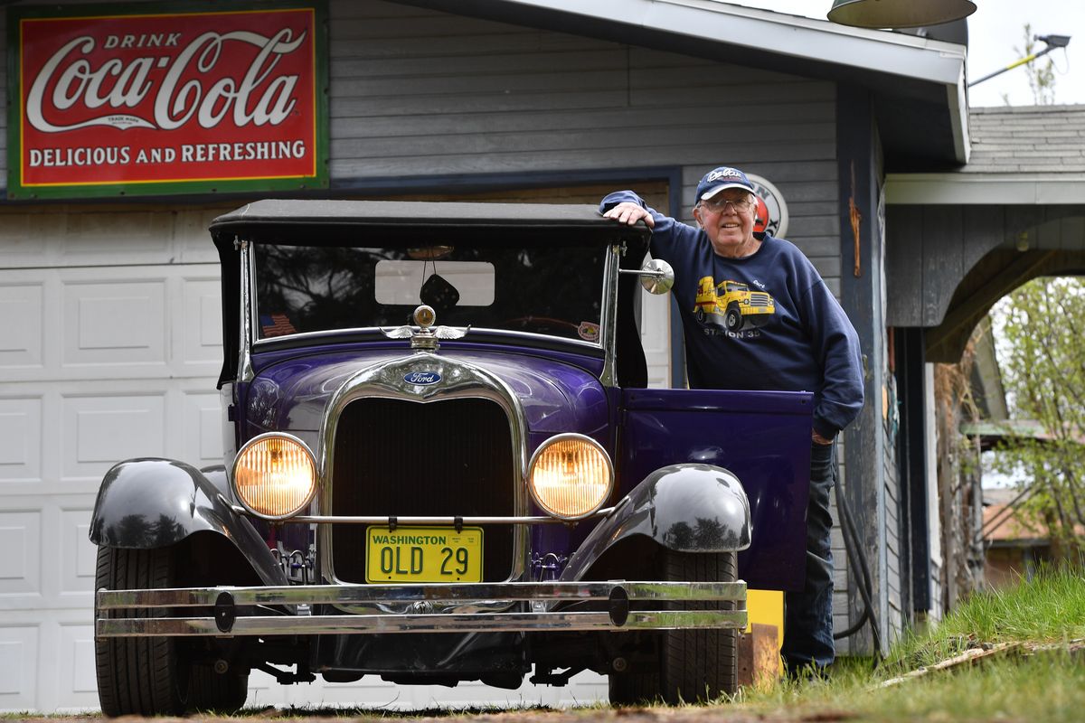 Curt Hanson poses for a photo with his Ford Model A on May 2 at his home in Spokane. Hanson towed the car to Spokane from his childhood home in Minnesota.  (Tyler Tjomsland/The Spokesman-Review)