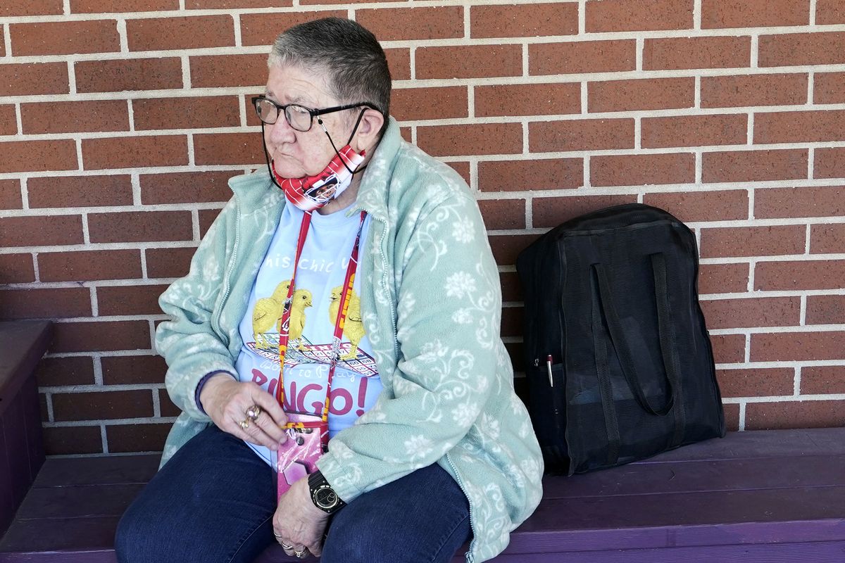 Pat Brown waits outside the Don Bosco Senior Center in Kansas City, Mo., Wednesday, March 3, 2021. Brown knows she needs the vaccine because her asthma and diabetes put her at higher risk of serious COVID-19 complications. But Wall hasn’t attempted to schedule an appointment and didn’t even know if they were being offered in her area yet; she says she is too overwhelmed.  (Orlin Wagner)
