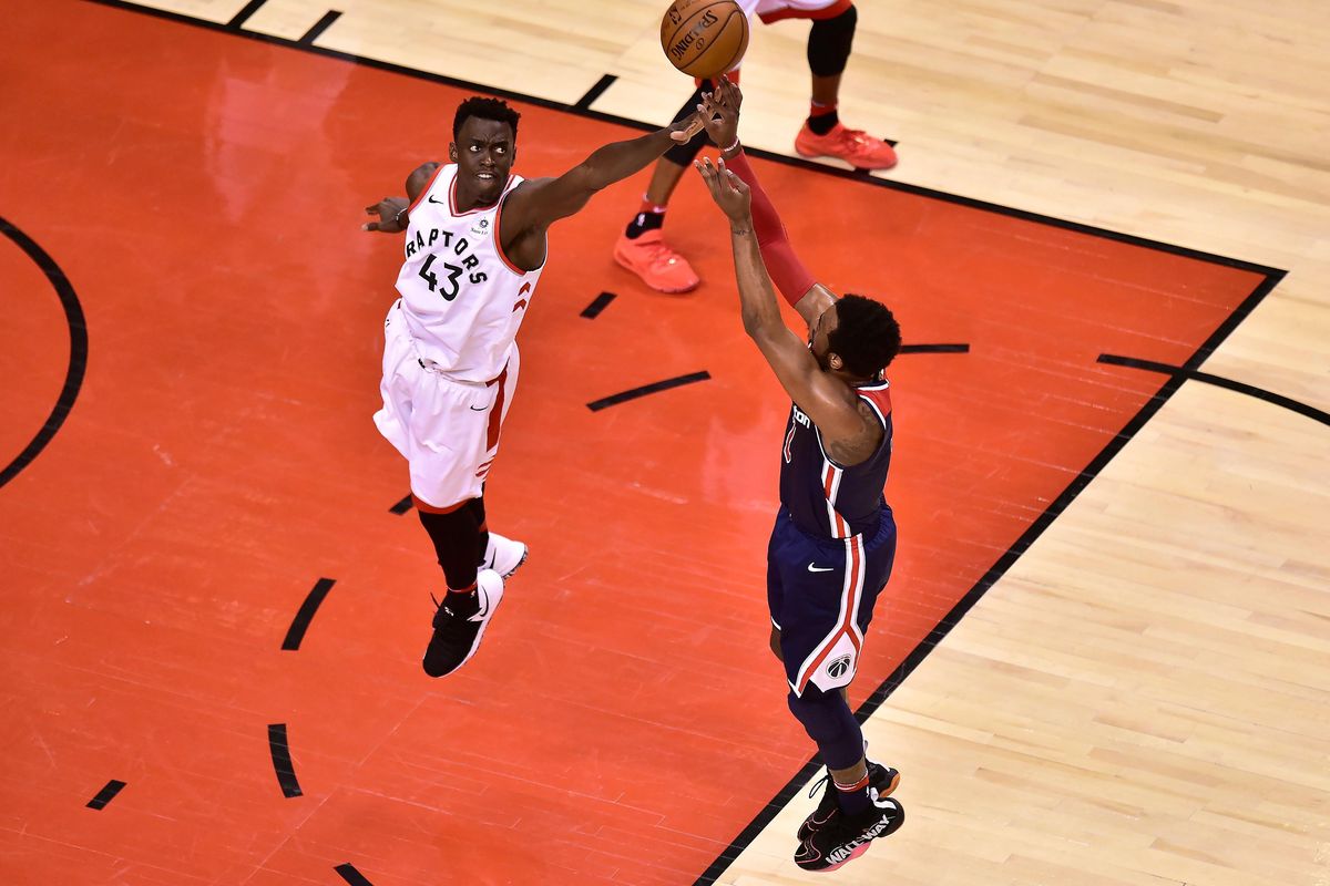 Washington Wizards guard John Wall (2) shoots as Toronto Raptors forward Pascal Siakam (43) defends during the second half of Game 2 of an NBA basketball first-round playoff series Tuesday, April 17, 2018, in Toronto. (Frank Gunn / Canadian Press via AP)
