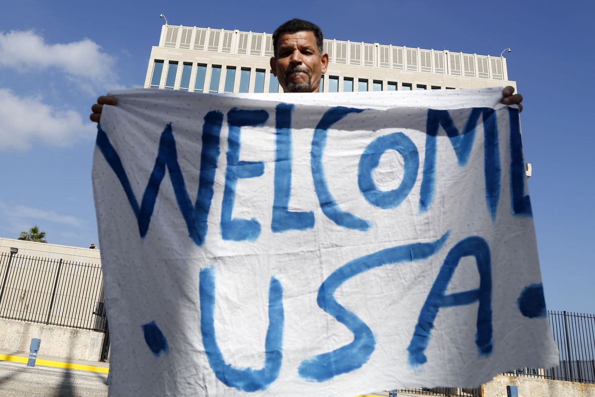 Cuban Lazaro Cudilleiro holds a banner in front of the United States Embassy in Havana, Cuba, Monday. (Associated Press)
