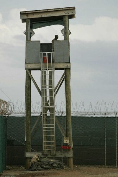 
An unidentified soldier watches over Camp Delta from a guard tower at Guantanamo Bay Naval Base.
 (Associated Press / The Spokesman-Review)