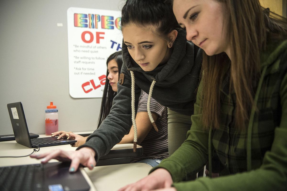 Left to right, America, Jadin and Ashley study for their GED test at Daybreak Youth Services, Wednesday, Dec. 28, 2016. (Liz Kishimoto / The Spokesman-Review)