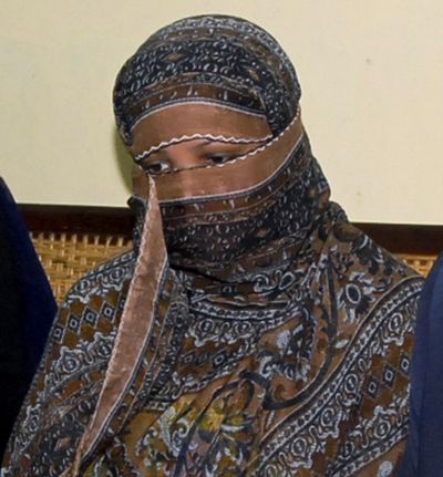 Asia Bibi, a Pakistani Christian woman, listens to officials in 2010 at a prison in Sheikhupura near Lahore, Pakistan. The Christian woman freed by Pakistan’s Supreme Court which acquitted her on blasphemy charge was transferred to southern Karachi by Pakistan’s security agencies, but has told a friend, who spoke to her on telephone, that she is being held in a room unable to leave and unable to find out when she can leave Pakistan. (Associated Press)