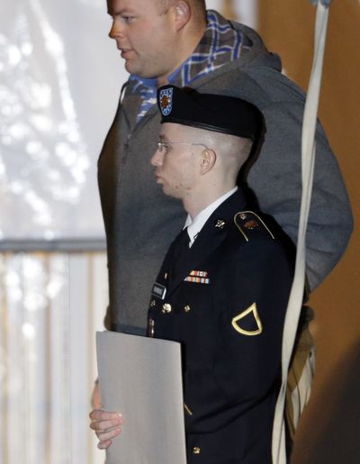 Army Pfc. Bradley Manning, front, is escorted out of a courthouse in Fort Meade, Md., on Thursday. (Associated Press)