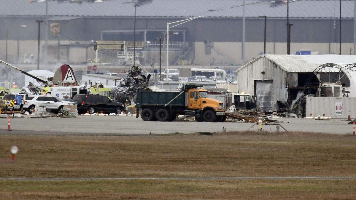 A fire-and-rescue operation is underway where World War II-era bomber plane crashed at Bradley International Airport in Windsor Locks, Conn., Wednesday, Oct. 2, 2019. A fire with black smoke rose from near the airport as emergency crews responded. The airport said in a message on Twitter that it has closed. (Jessica Hill / Associated Press)