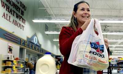 Jill Daly, of Athol, shops at Super 1 in Rathdrum  on Friday  using her new Visa card issued  by the Idaho Department of Health and Welfare. Daly was part of a pilot program for the cards  for people who get child support that the state helps collect.  (Kathy Plonka / The Spokesman-Review)