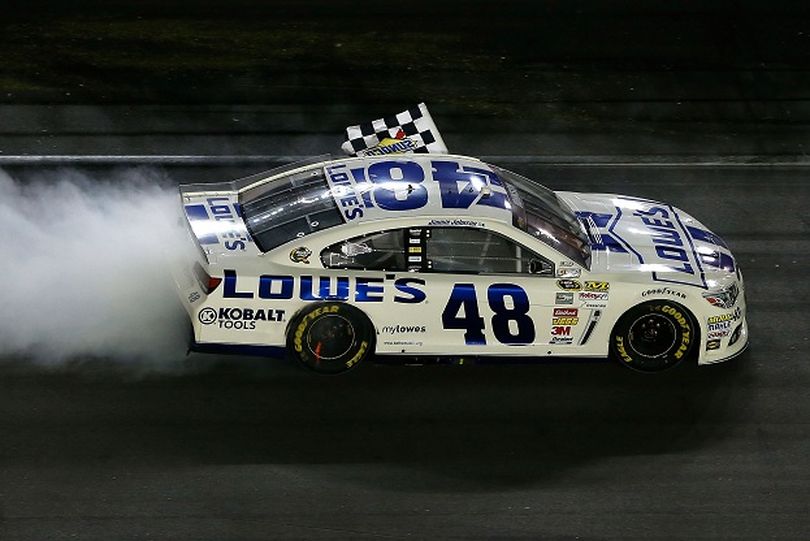 Jimmie Johnson, driver of the #48 Lowe's Dover White Chevrolet, celebrates with the checkered flag as he performs a burnout after winning the NASCAR Sprint Cup Series Coke Zero 400 at Daytona International Speedway on July 6, 2013 in Daytona Beach, Florida. (Photo Credit: Scott Halleran/Getty Images) (Scott Halleran / Getty Images North America)