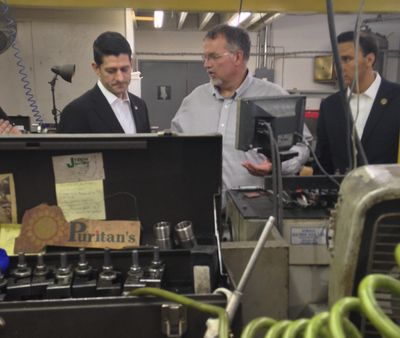 House Speaker Paul Ryan of Wis., Rep. Ryan Costello, R-Pa., right, and Scott Johnson, center, owner of J-Tech tour the company in Chester Springs, Pa., on Thursday, Oct. 6, 2016. (Alan Fram / AP)