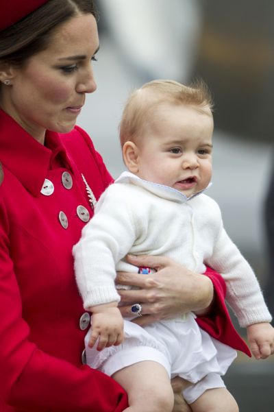 Duchess Catherine holds Prince George after arriving in New Zealand today.