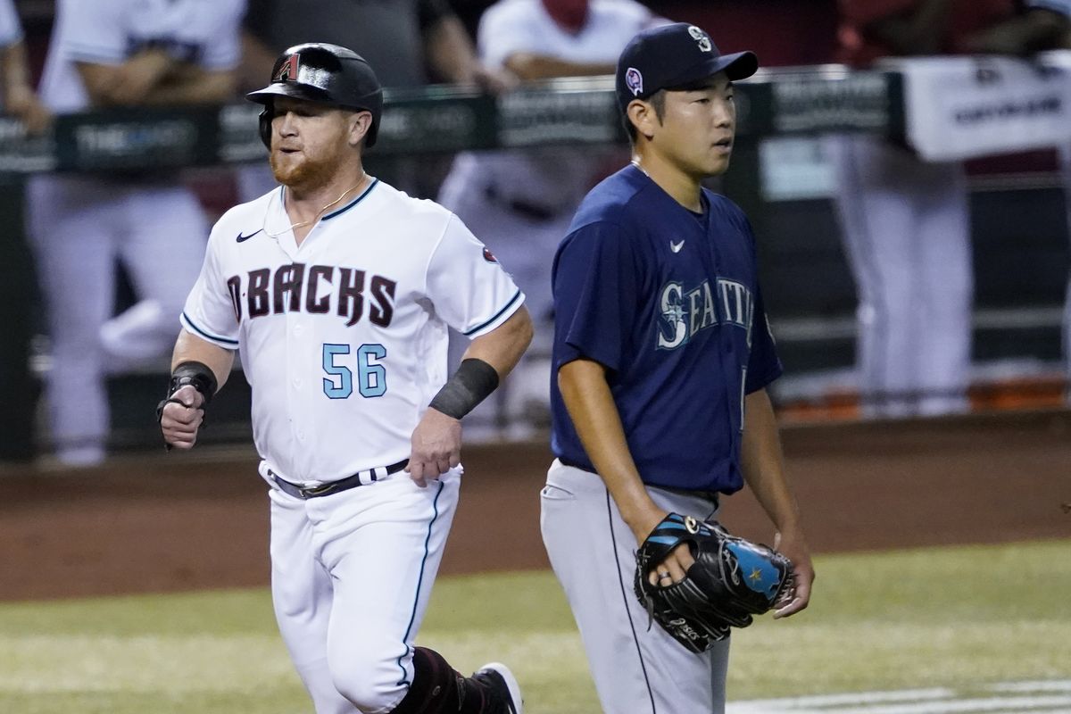 Kole Calhoun scores on wild pitch to push Angels past Mariners in