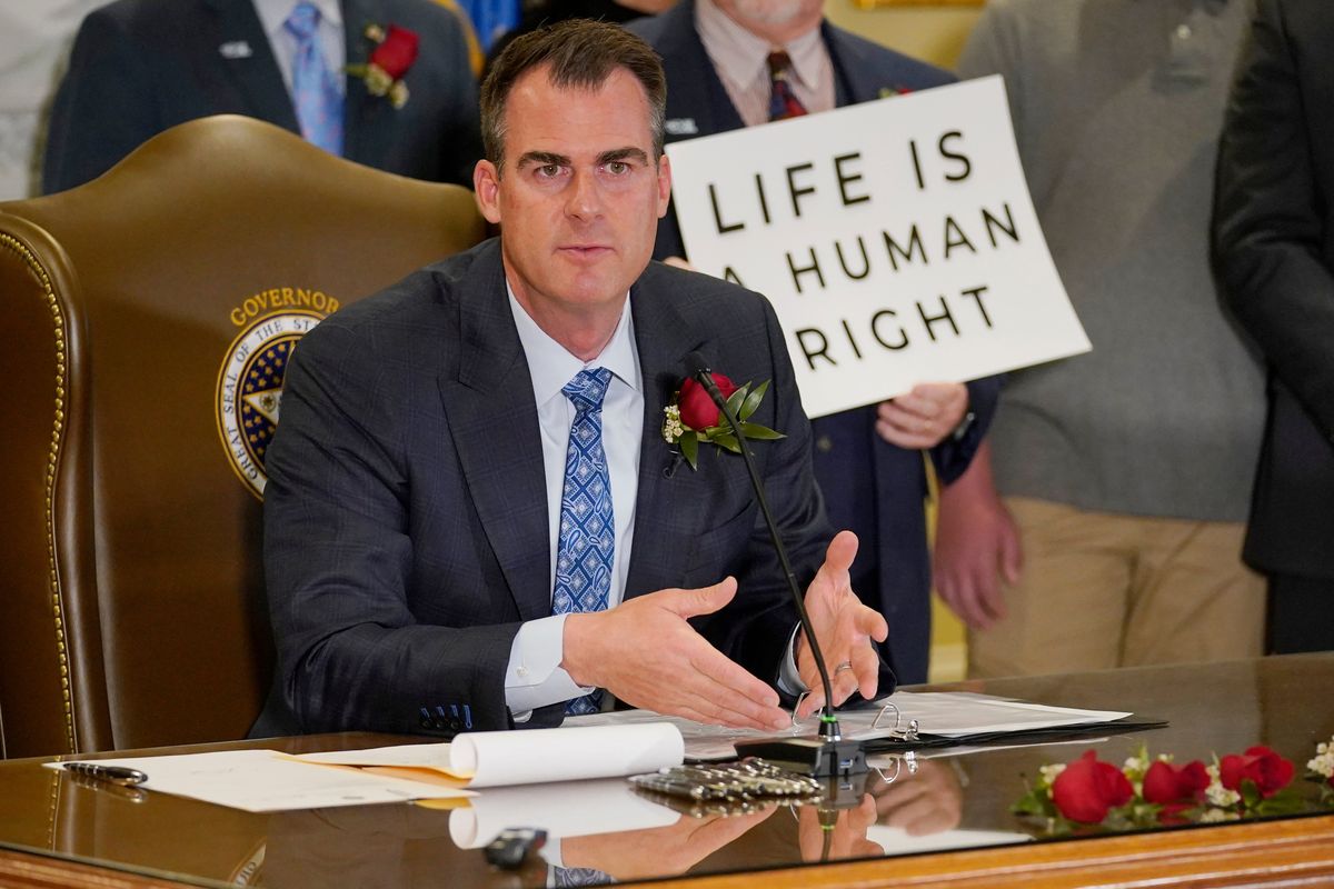 Oklahoma Gov. Kevin Stitt speaks after signing into law a bill making it a felony to perform an abortion, punishable by up to 10 years in prison, Tuesday, April 12, 2022, in Oklahoma City.  (Sue Ogrocki)