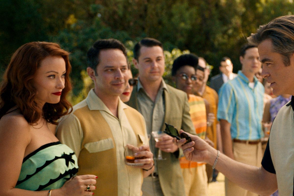Chris Pine, right, with Olivia Wilde, left, and Nick Kroll in “Don’t Worry Darling.”  (Warner Bros. Pictures)