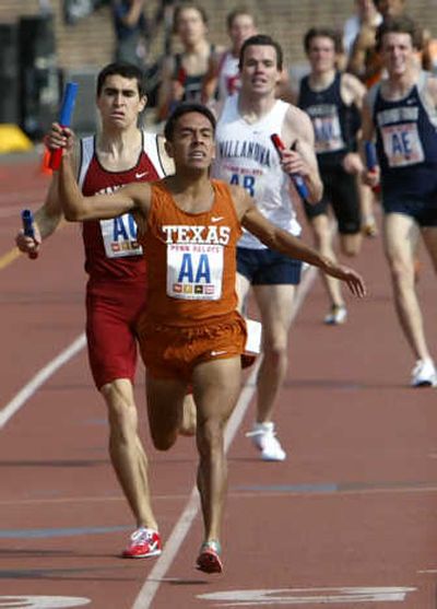 Texas' Leonel Manzano crosses the finish line to win the college men's distance medley relay at the Penn Relays.Associated Press
(Associated Press / The Spokesman-Review)