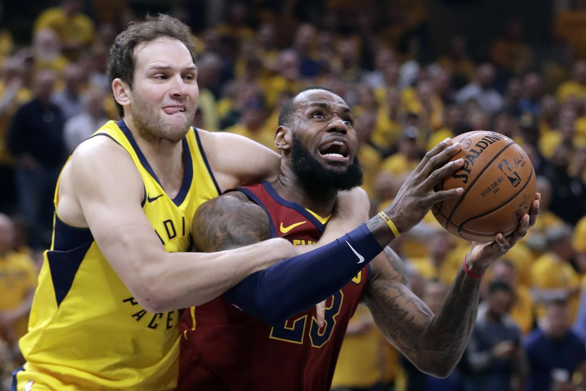 Cleveland Cavaliers’ LeBron James, right, is fouled on his way to the basket by Indiana Pacers’ Bojan Bogdanovic during the first half of Game 6 of a first-round NBA basketball playoff series, Friday, April 27, 2018, in Indianapolis. (Darron Cummings / Associated Press)