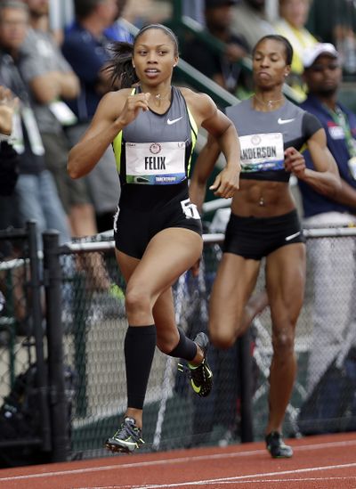 Allyson Felix wins her heat Friday during the semifinals of the women’s 200-meter dash at the U.S. Olympic Track and Field Trials. (Associated Press)