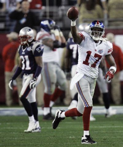 New York Giants receiver Plaxico Burress will have to wait until at least next year to celebrate another touchdown reception. (File Associated Press / The Spokesman-Review)